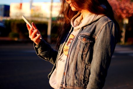 Woman In Blue Denim Jacket Daytime Photography photo