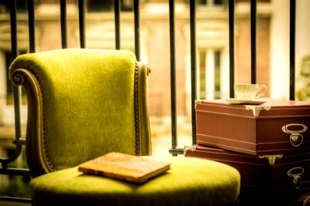 Yellow Book On Green Ottoman