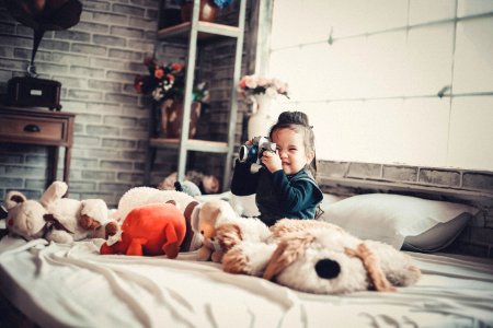 Photo Of A Girl Playing With The Camera