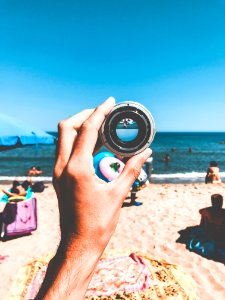 Person Holding Camera Lens