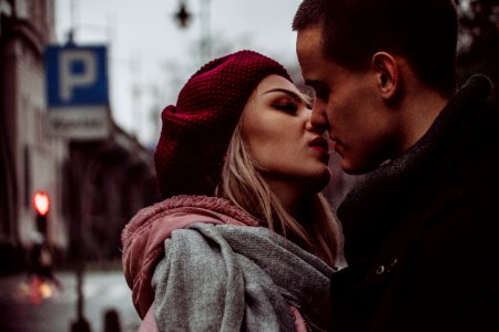 Close Up Photograph Of Woman Kissing Man photo