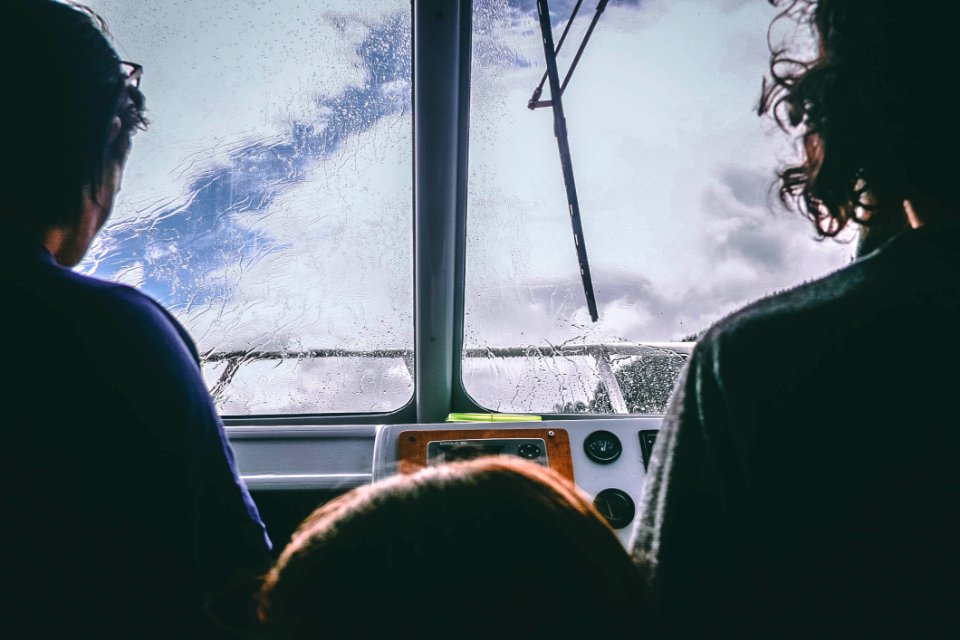 Two Person Facing In Front Of The Glass