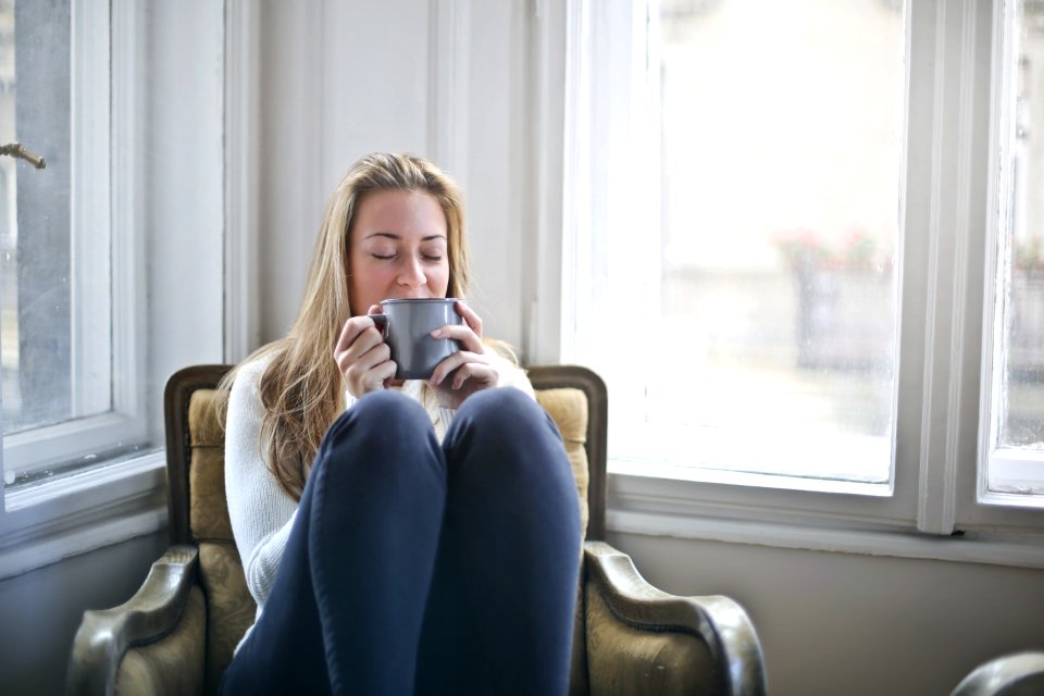 Woman Holding Gray Ceramic Mug