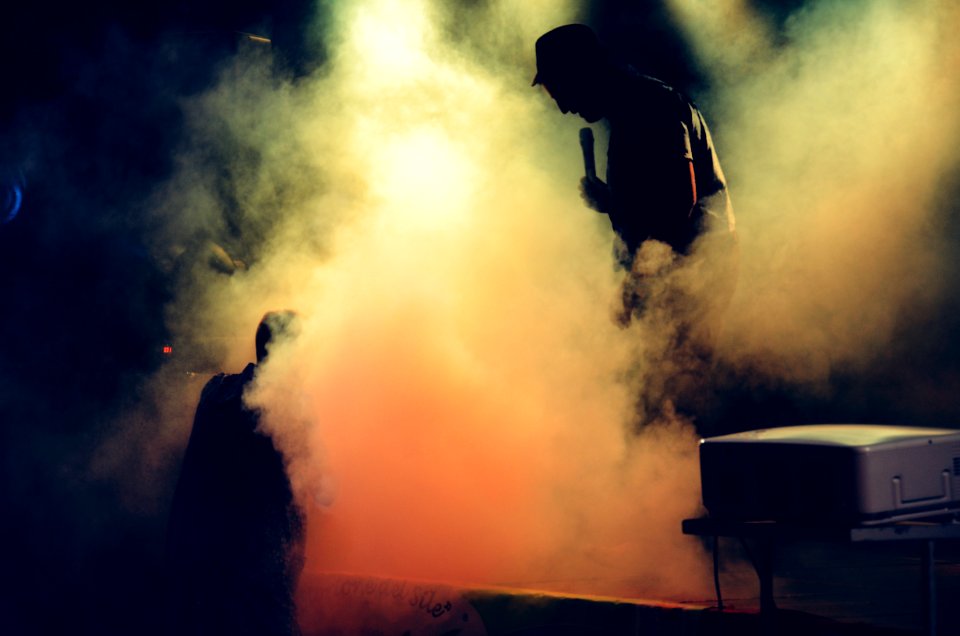 Man Holding Microphone At The Stage