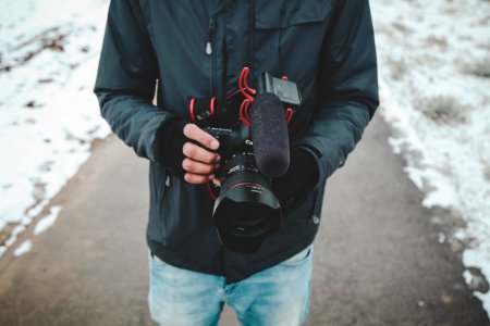 Man Holding Dslr Camera photo