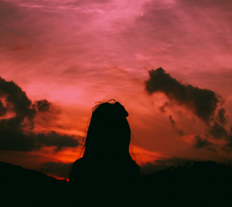 Silhouette Of A Woman During Dawn photo