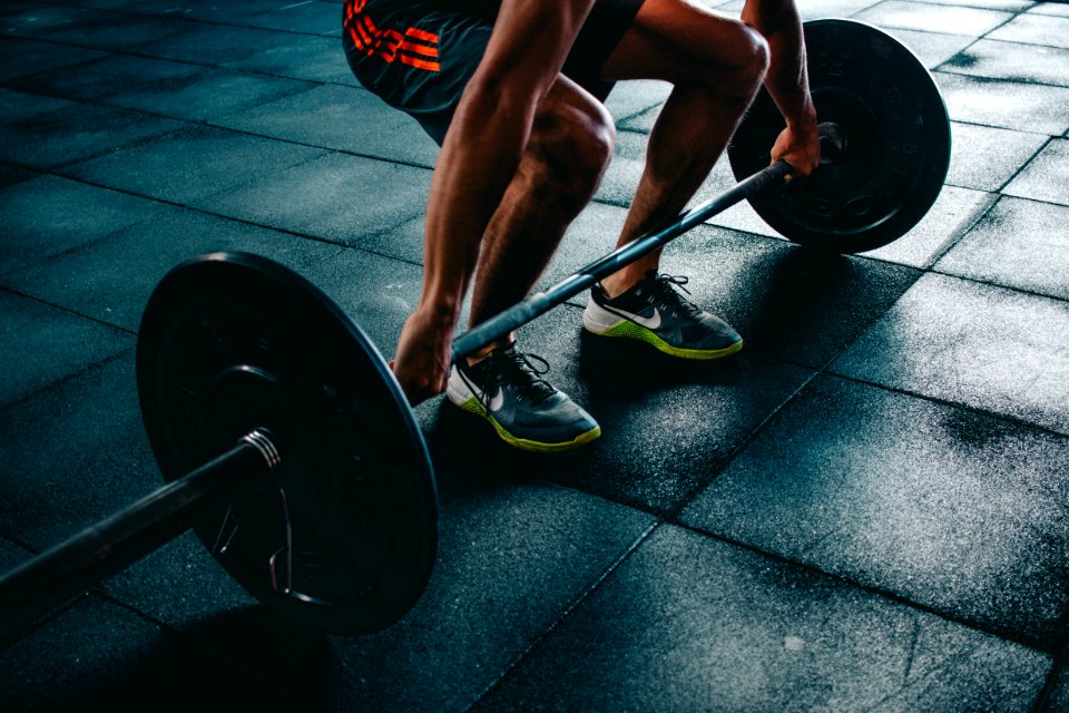 Person Holding Barbell photo