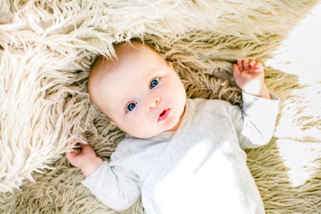 Baby In White Onesie