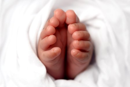 Babies Feet Selective Focus Photo photo