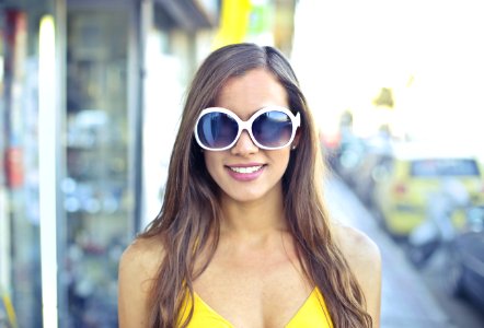 Woman Wearing Yellow Spaghetti Strap Top And Round Sunglasses