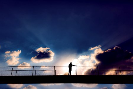 Man In The Middle Of A Bridge