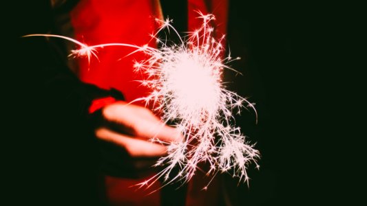 Photo Of A Persons Hand Holding Firecracker photo