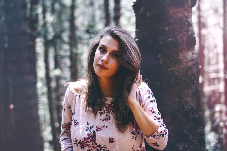 Woman In Floral Scoop-neck Blouse
