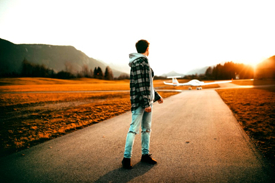 Photography Of A Man Wearing Gray Jacket Looking Back