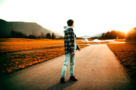 Photography Of A Man Wearing Gray Jacket Looking Back