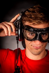Man Wearing Red Crew Neck Shirt And Black Goggles photo