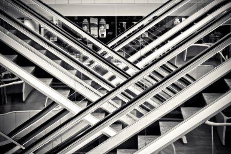 Grayscale Photography Of Staircases With Handrails photo