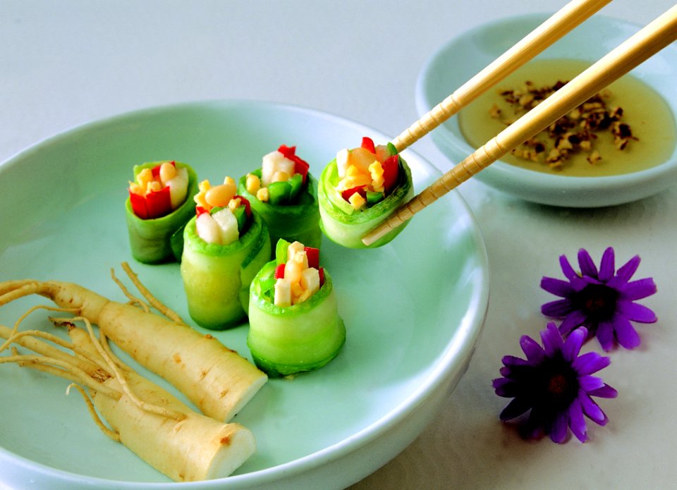 Vegetable Covered With Food Wrapper On Green Bowl With Chopstick Beside Purple Flower