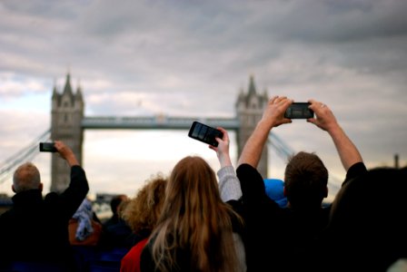 People Taking Picture At Tower Bridge Under Gray Clouds