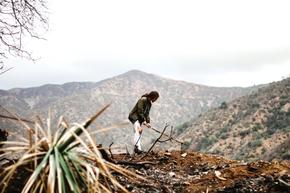 Full Length Of A Young Man With Mountain In Background