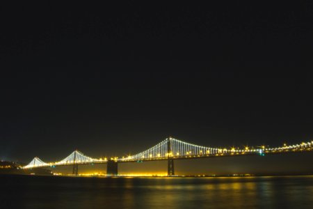 Lighted Bridge At Nighttime photo