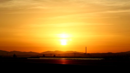 Silhouette Of Mountain Under Sunset photo