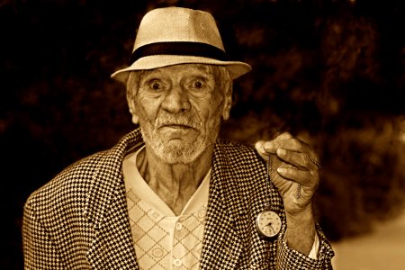 Grayscale Photo Of A Man In Houndstooth Print Suit Jacket Wearing A Hat photo
