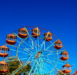 The Ferris Wheel In Blue Sky