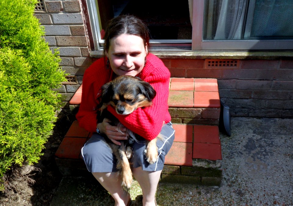 Wife With The Dog On Her Lap