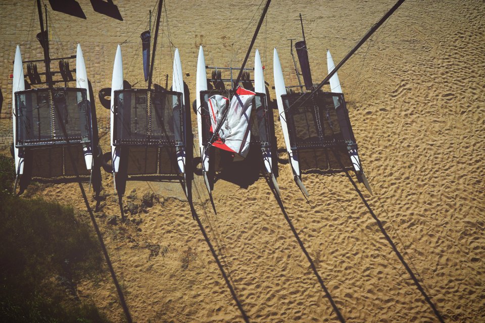 Areal View Of 4 White Inflatable Boat On Brown Sands During Daytime