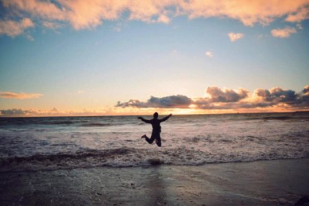 Person Taking Picture In Seashore During Sunset