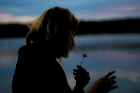 Girl Looking At Flower