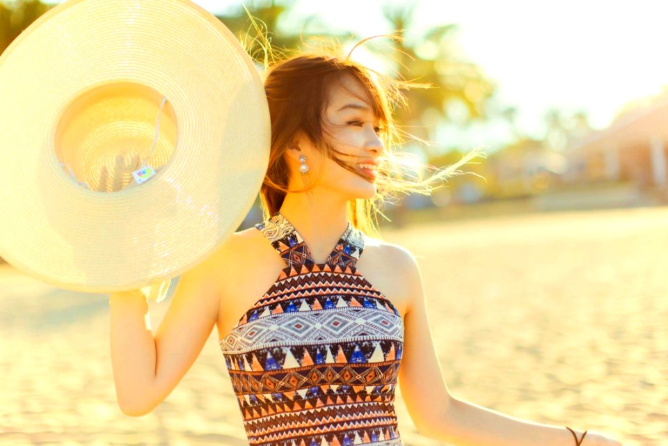 Woman With Hat On Beach