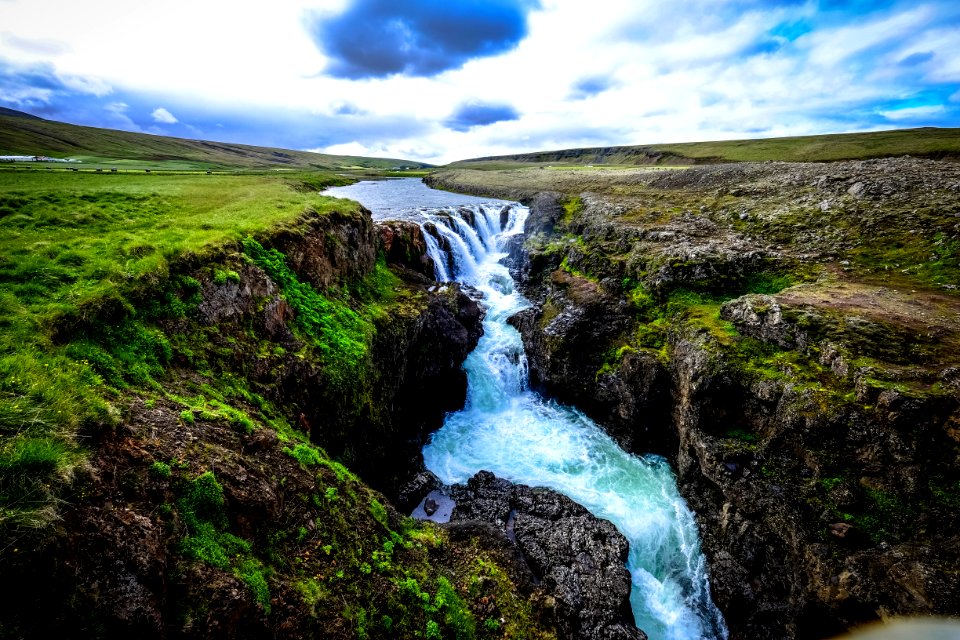 Waterfall Over Rocky Cliffs