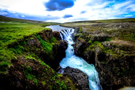 Waterfall Over Rocky Cliffs