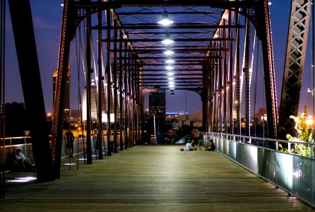 Illuminated Bridge In City At Night photo