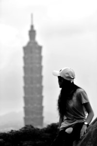 Woman Looking At High Rise Tower