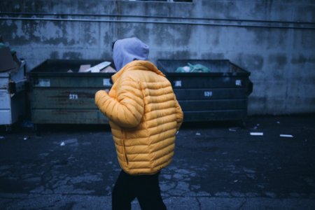 Person In Yellow Puffer Jacket Walking photo