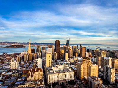 High Angle View Of Cityscape Against Cloudy Sky photo