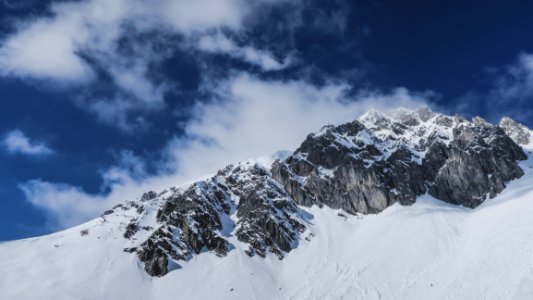 Scenic View Of Snowcapped Mountains Against Sky photo