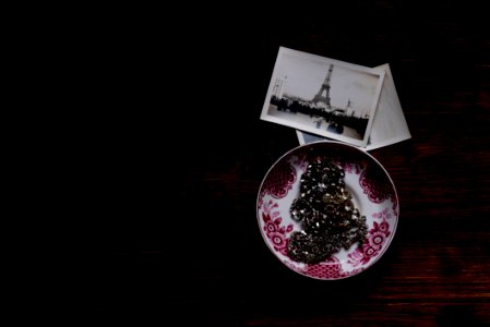Silver Chain Accessory On White And Purple Ceramic Plate Near Grayscale Eiffel Tower Picture