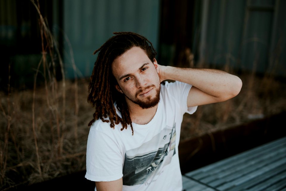 Portrait Of Man Sitting Outdoors photo