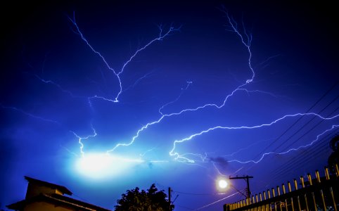 Lightning Bolts Above Buildings photo