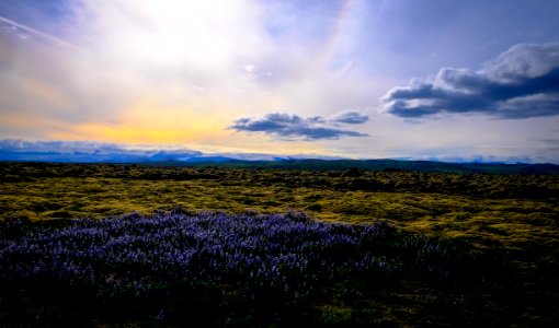 Sunset And Clouds Over Hay Field
