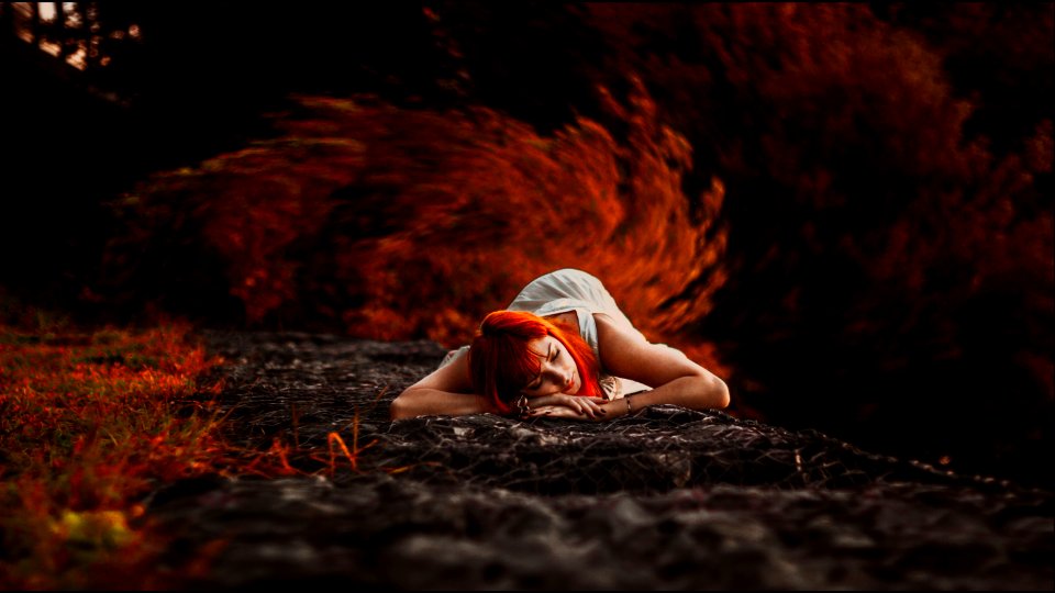 Woman In White Tank Dress Lying On Ground photo