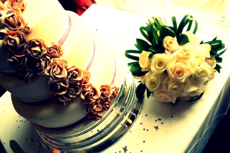 Bridal Bouquet And Wedding Cake photo
