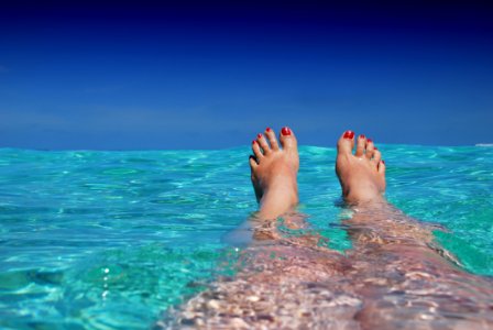 Woman Floating In Sea
