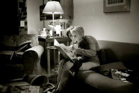 Woman Reading With Baby photo