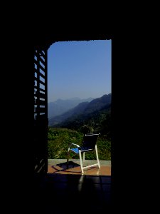 Blue And White Empty Armchair During Daytime Outside With Mountain Range Under Blue Sky During Daytime