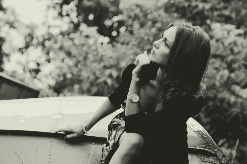 Thoughtful Woman Sat Outdoors
